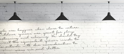 McGuigans wall, white brick wall with writing on it